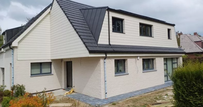Gevelisolatie en dakrenovatie door Reno Wall Construct in Rixensart, woning na de werken